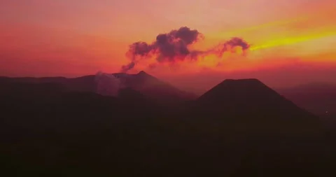 Pink Sunset Glow Over Mount Bromo Volcano – Cinematic Aerial Stock Footage 329260882