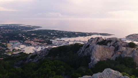 Pink Sunset Light Over Porto Cervo Marina and Granite Cliffs, Sardinia Drone Stock Footage 341067271