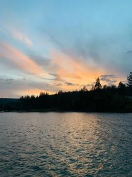Pink Sunset over a Line of Trees on Lake Tahoe Stock Photos