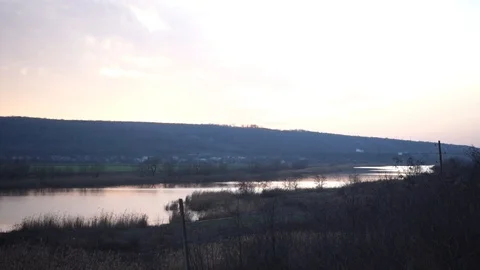 Pink sunset over the river and forest Stock Footage 121105924