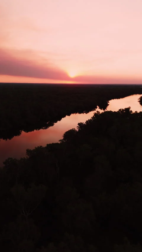 Pink Sunset Over River and Forest in Northern Territory, Australia Stock Footage 287987489