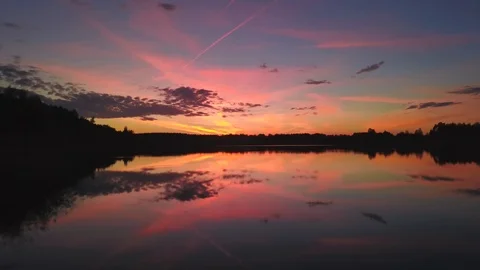 Pink sunset over river on summer evening, aerial view Stock Footage 98084977
