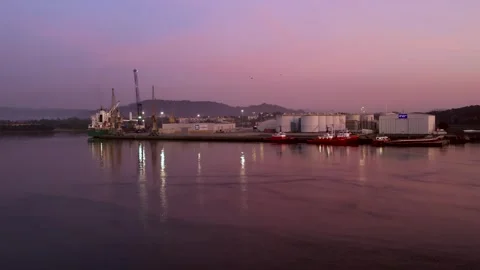 Pink sunset on the river with a ship on the harbor Stock Footage 263544964