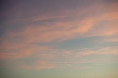 Pink sunset sky with clouds Stock Photos