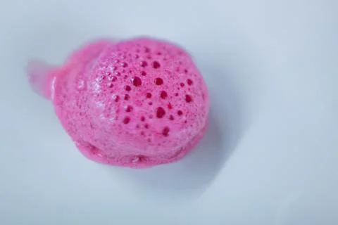 Pink tablet on white background Photos