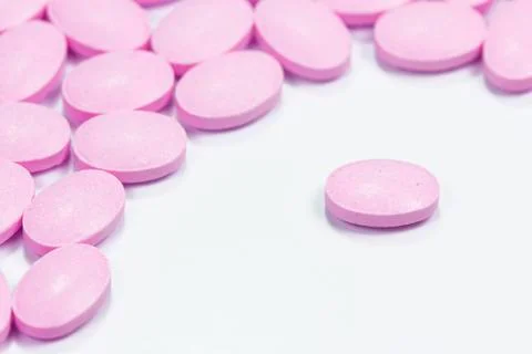 The pink tablets isolated on white background Stock Photos