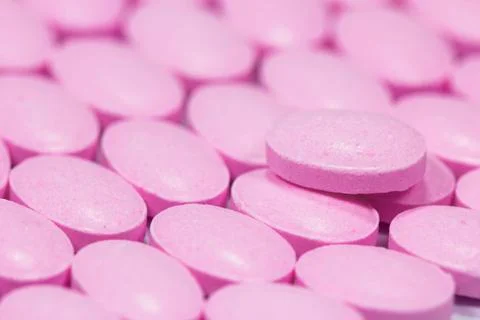 The pink tablets isolated on white background Stock Photos