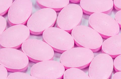The pink tablets isolated on white background Foto stock