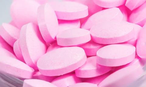 The pink tablets isolated on white background Stock Photos