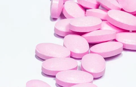 The pink tablets isolated on white background Stock Photos