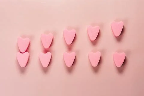 Pink tampons stringless on pink background. Stock Photos