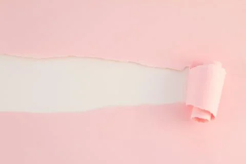 Pink teared paper with copy space Stock Photos