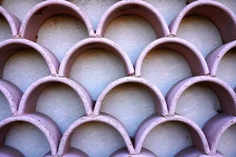 Pink terracotta clay tile pattern background with decorative semicircular s.. Stock Photos
