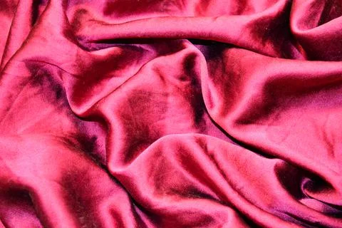 Pink textile pattern as a background. Pink material texture on fabric Stock Photos