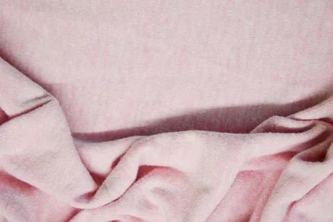 Pink textile pattern as a background. Pink material texture on fabric Stock Photos