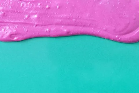 Pink texture with bubbles on a turquoise background, a minimalist backdrop fo Stock Photos