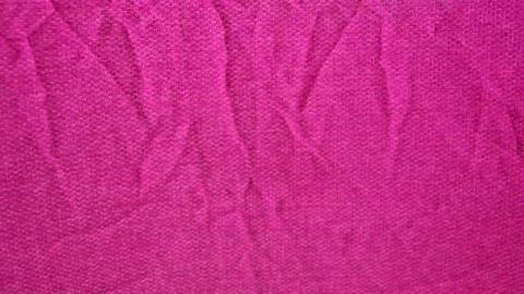 Pink textured fabric surface with visible woven fibers and folds Stock Photos