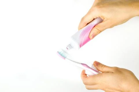 Pink toothpaste toothbrush Stock Photos