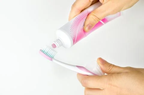 Pink toothpaste toothbrush Stock Photos