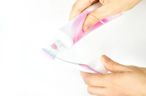Pink toothpaste toothbrush Stock Photos