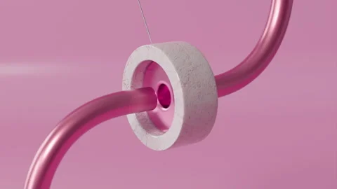 A pink tube and a ring on a string in a satisfying 3d animation Stock Footage 253595773
