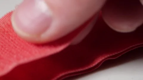 Pink Velcro Strap Separating with Sharp Rustling Sound as Hook and Loop Surfaces Stock Footage 321528517