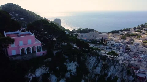 Pink villa overlooking the sea at sunset in capri, italy Stock Footage 345374754