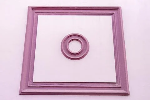 Pink wall with square and circle patterns architecture Costa Rica. Stock Photos