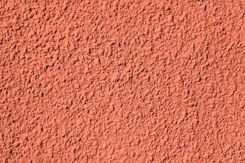 Pink wall, texture, background. Relief surface. Plastered building wall Stock Photos