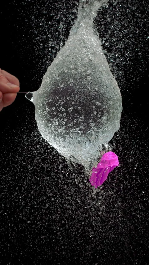 Pink Water Balloon Explosion From Needle Stab Stock Footage 314303160