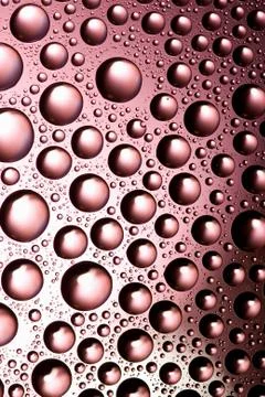 Pink water drops background Stock Photos