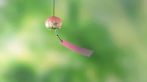 Pink Wind Chimes on a Green Background Stock Footage 327421427