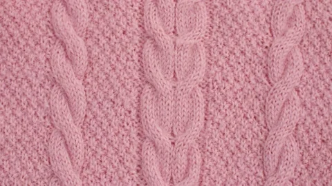 Pink wool knitted fabric Stock Footage 137655947