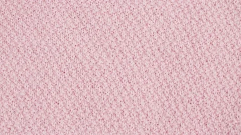 Pink wool knitted fabric Stock Footage 137656099