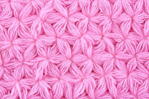 Pink woolen texture background. Macro of knitted cloth Foto stock