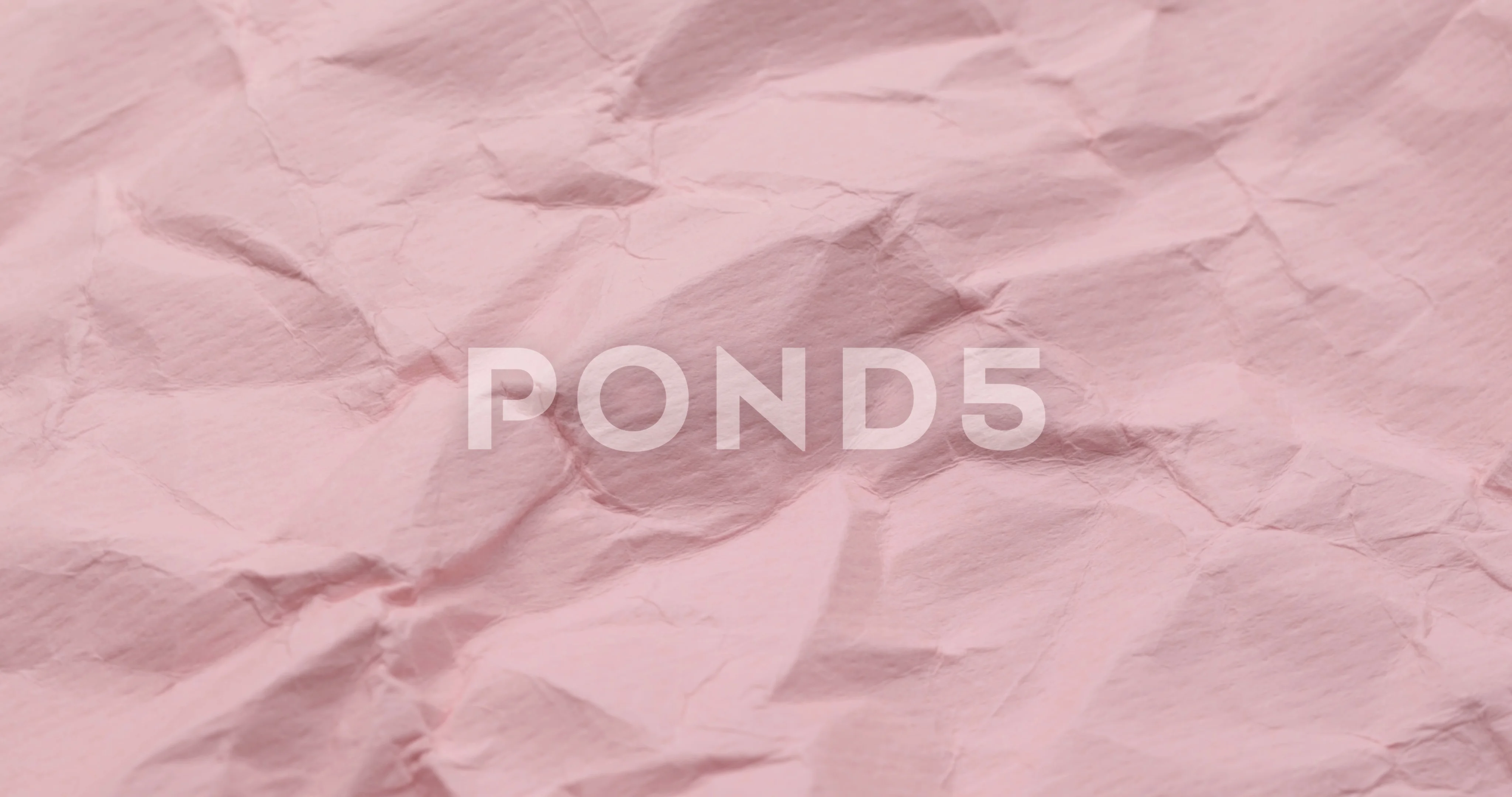 Wrinkle pink paper texture in rotation, Stock Video