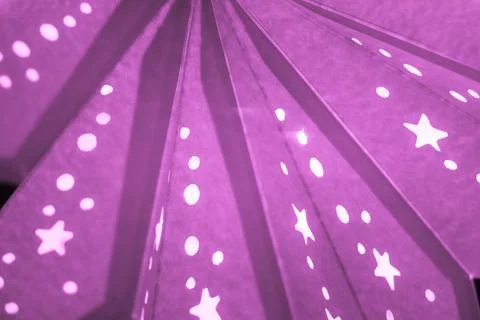 Pink xmas lantern star pattern at christmas market season. Shiny star mood la Stock Photos