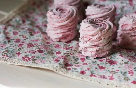The pink zephyr on rustic napkin. Close up Stock Photos