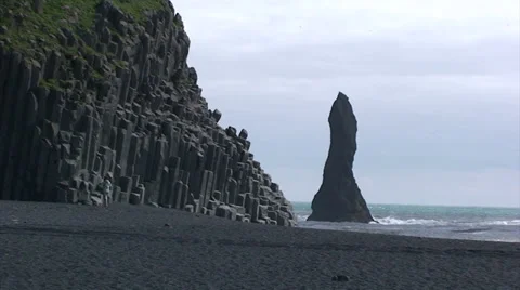 Pinnacle on sea and basalt column cliff on volcanic beach 스톡 동영상 37580459