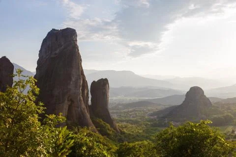Pinnacles of rocks in Meteora landscape panorama at sunset, Greece Stock Photos