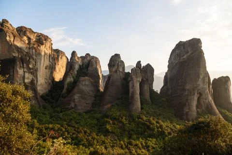 Pinnacles of rocks in Meteora landscape panorama at sunset, Greece Stock Photos