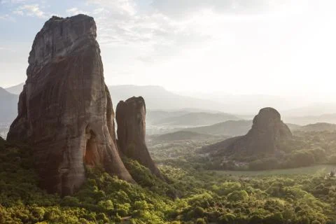 Pinnacles of rocks in Meteora landscape panorama at sunset, Greece Stock Photos
