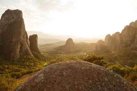 Pinnacles of rocks in Meteora landscape panorama at sunset, Greece Stock Photos