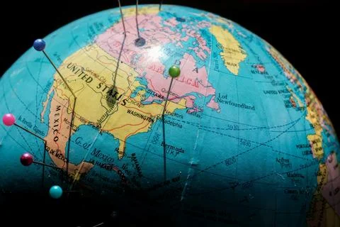 Pinned cities on a globe Stock-Fotos
