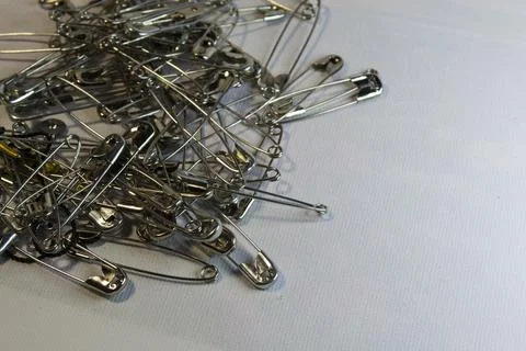 Pins close-up on a white background. Stock Photos