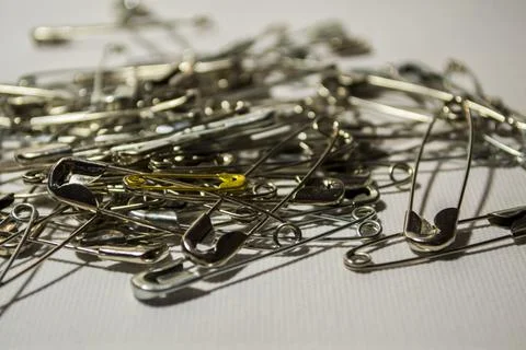 Pins close-up on a white background. Stock Photos
