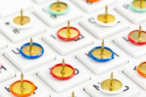 Pins on computer keyboard Stock Photos