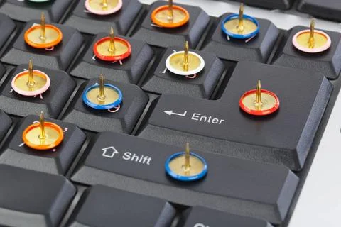Pins on computer keyboard Pins on computer keyboard - concept background C... Foto stock