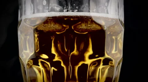 Pint of beer on rotating display Stock Footage 49724262