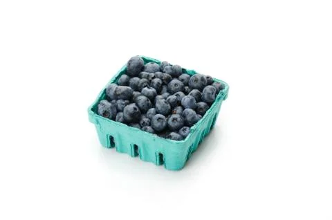 Pint container of blueberries on white 스톡 사진
